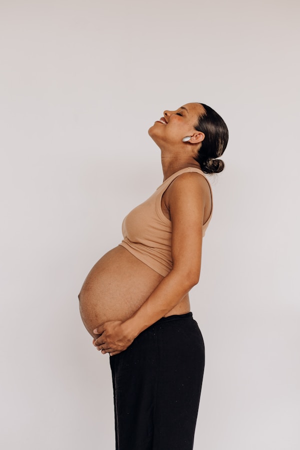 Pregnant woman, exposed belly, grounded and nourished